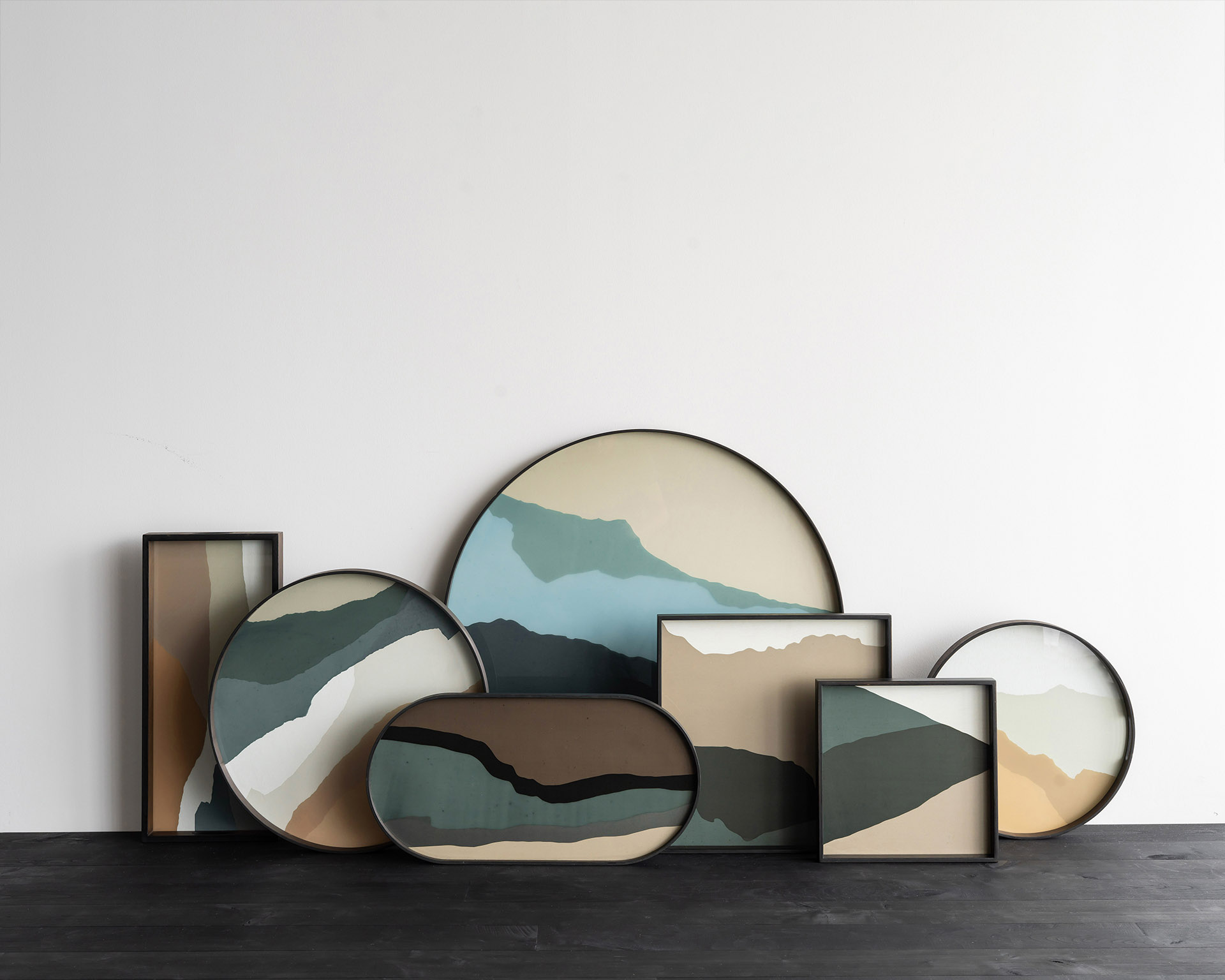 Collection of decorative trays with abstract landscape designs from Cuchi NZ, modern home accessories and designer furniture Auckland.