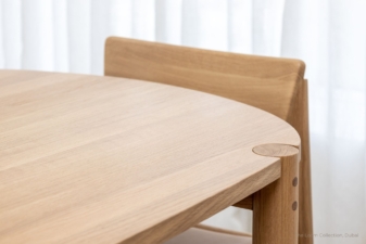 Close-up of a light oak wood modern dining table nz and chair set, showcasing smooth craftsmanship, rounded joints, and minimalist Scandinavian-inspired design. supplied from cuchi nz