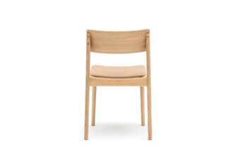 Back view of a minimalist wooden chair with a natural oak finish and a comfortable cushioned seat, highlighting the clean lines and modern design.