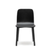 Front view of a modern black dining chair with curved wooden seat and rounded legs, designed in a minimalist Scandinavian style.