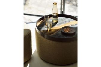 Round decorative tray table from Cuchi NZ with amber glass jug, tumblers, and nut bowl, modern furniture Auckland and home accessories.