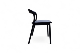 Side view of a modern black chair with a curved backrest and slim legs, designed for comfort and sleek, minimalist appeal.