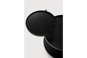 Top-down view of three-tier round black nesting tables with wood grain finish, staggered in height and slightly overlapping.